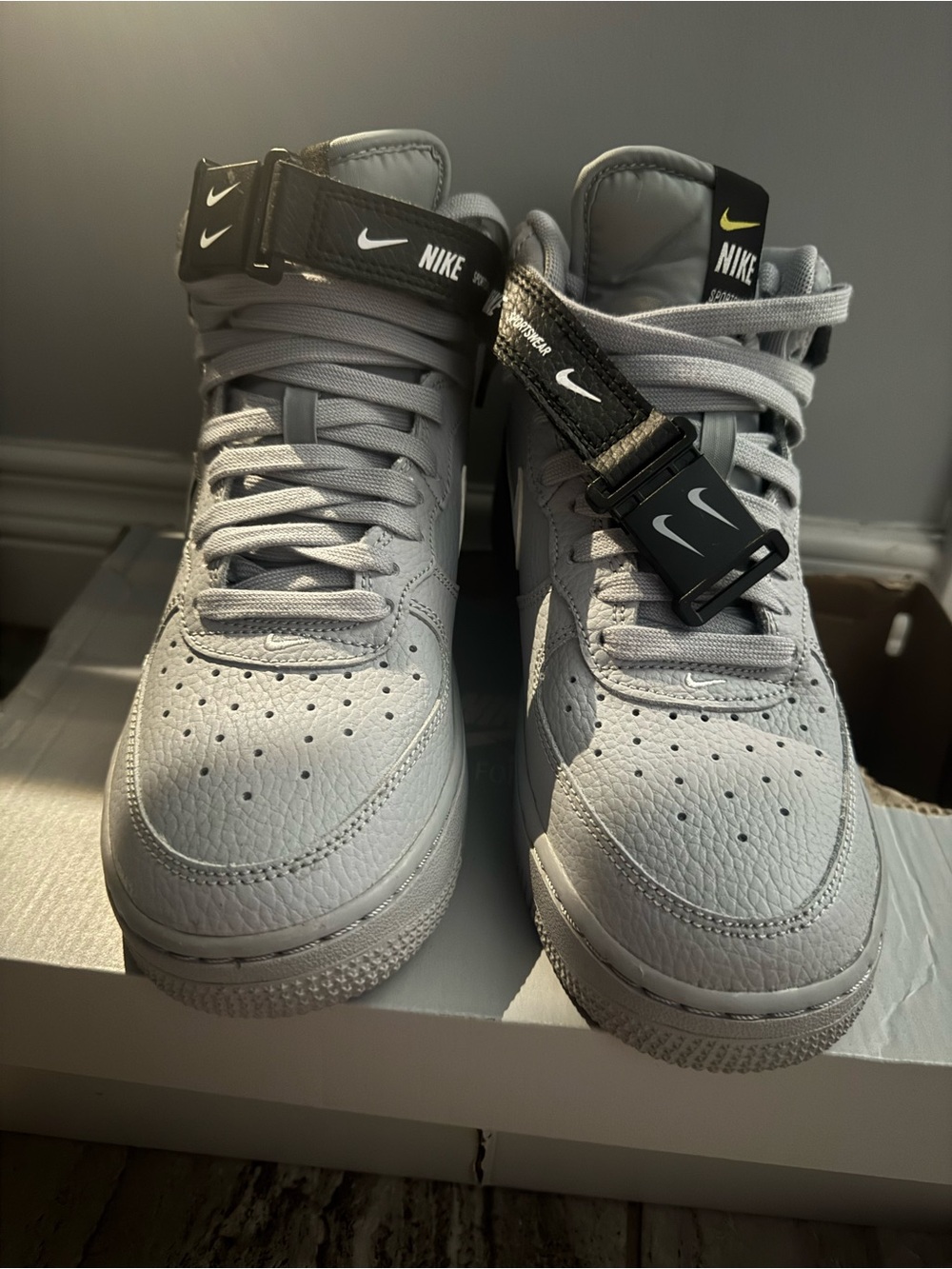 Nike High-Top Sneakers in Light Gray with Black Strap